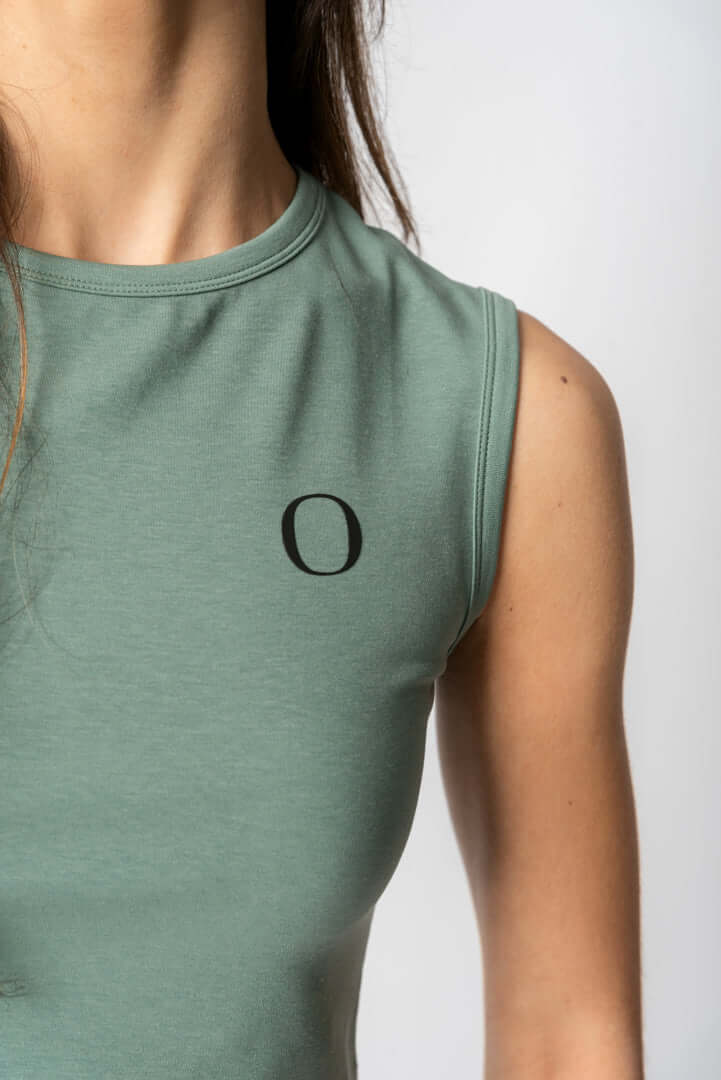 women wearing a crop top showing detail of of organique logo