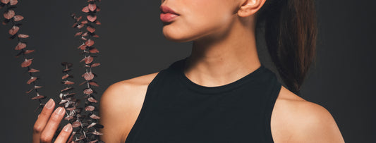 Detailed shot of sustainable tank top neckline in black.