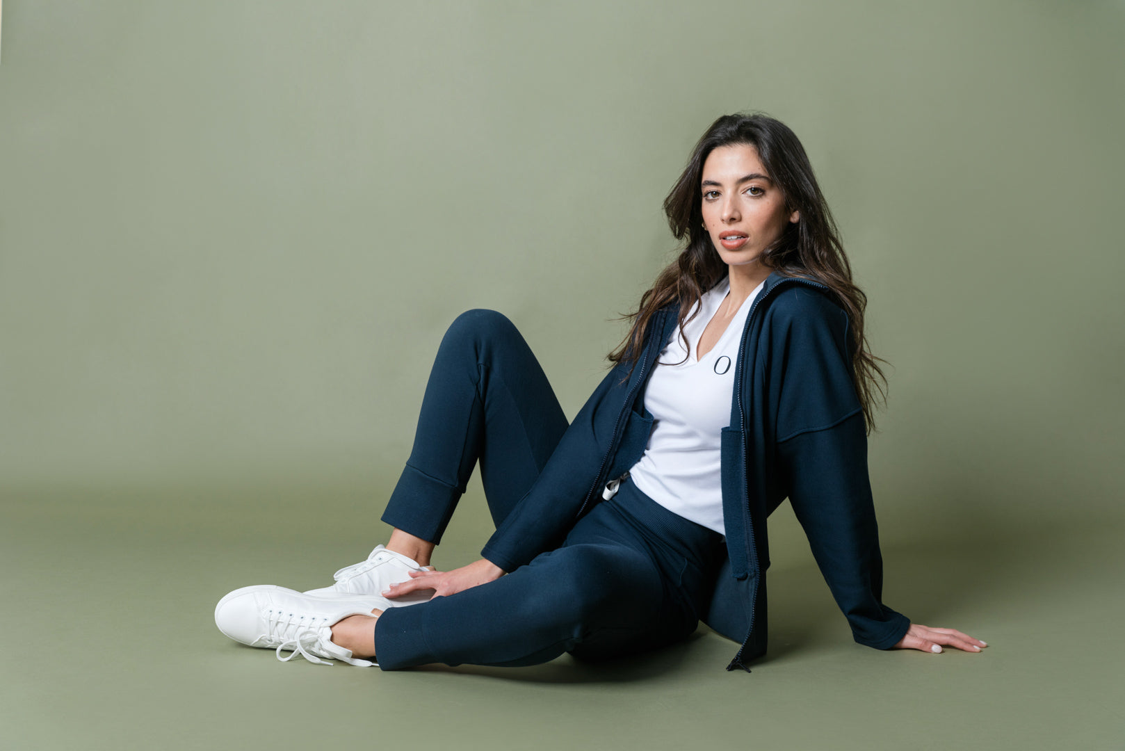 Woman using a blue set of organic cotton jacket and sweatpants