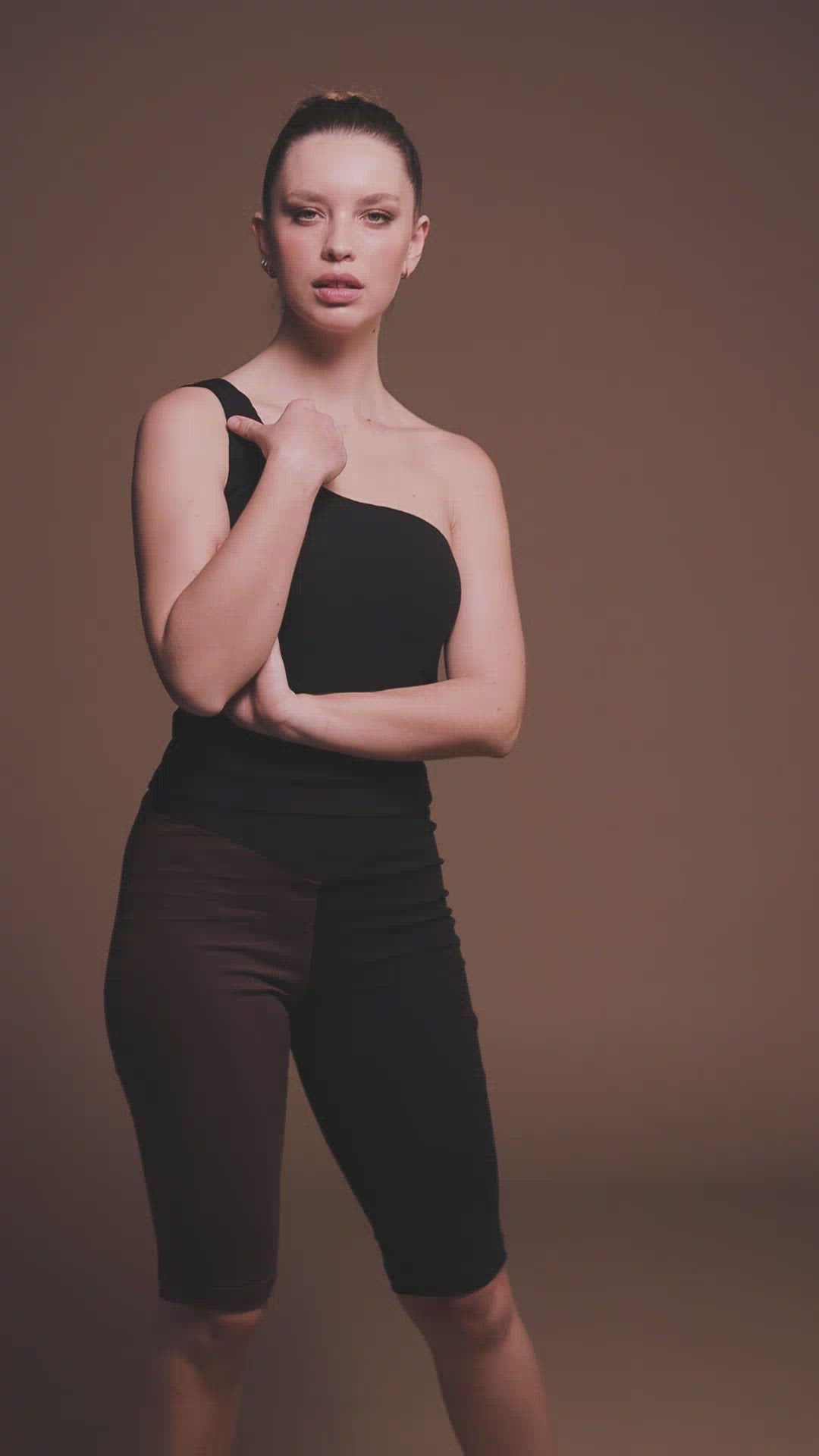Video of Organic Cotton One Shoulder top made by Organique, a sustainable clothing brand.
