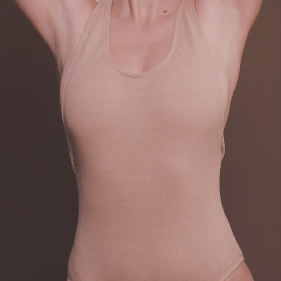 Video of: Sustainable Cross Back Bodysuit in Light Brown made by Organique.