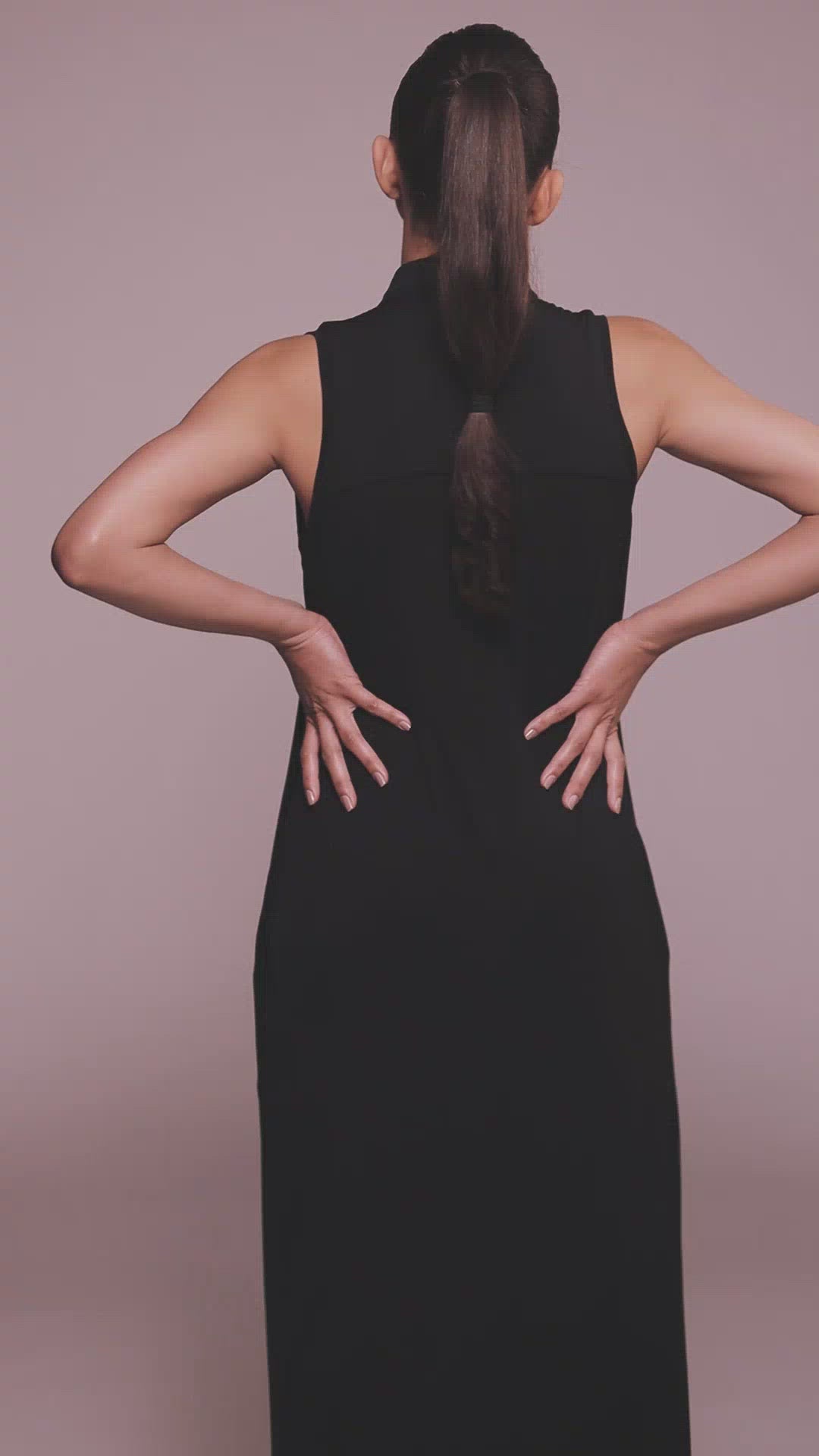 Video of Lyocell  black sleeveless dress made by Organique, a sustainable clothing brand.