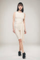 Image of a women using a off white cycling jumpsuit