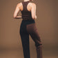 Image of back of vegan trousers in black and brown made by Organique, a sustainable clothing brand.