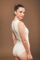 Image of vegan sleeveless bodysuit in ecru made by Organique, a sustainable fashion brand.