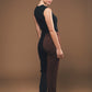 Image of back of vegan jumpsuit in black and brown made by Organique, a sustainable clothing brand.